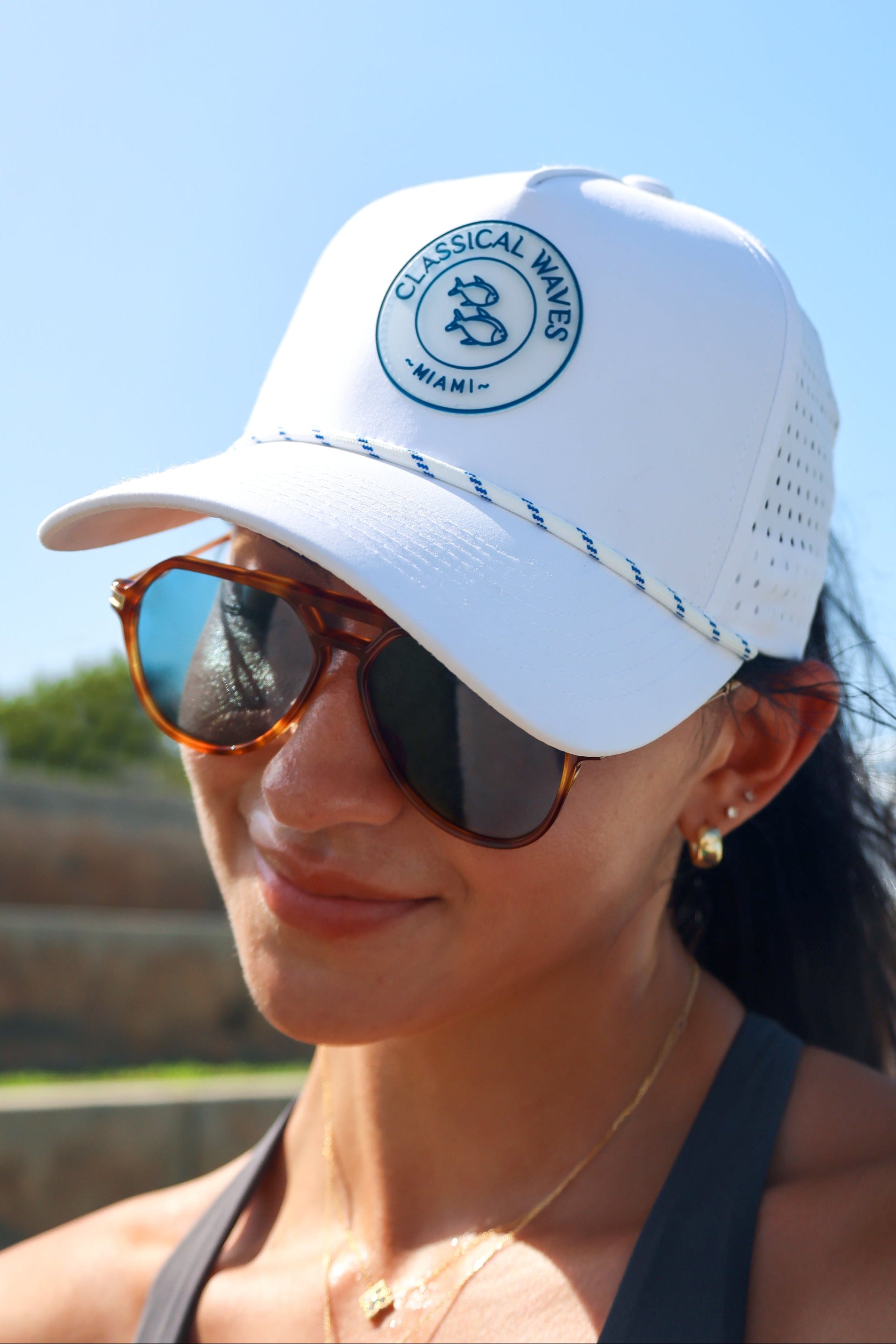 White beach hat with logo, stylish coastal lifestyle accessory